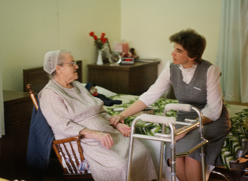 Diane Jacobs speaking with resident in 1980s/1990s